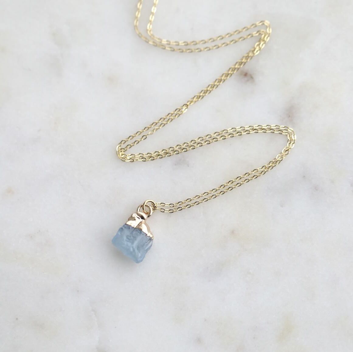 Close-up of Aquamarine Birthstone on Gold Chain Necklace by Mrs V