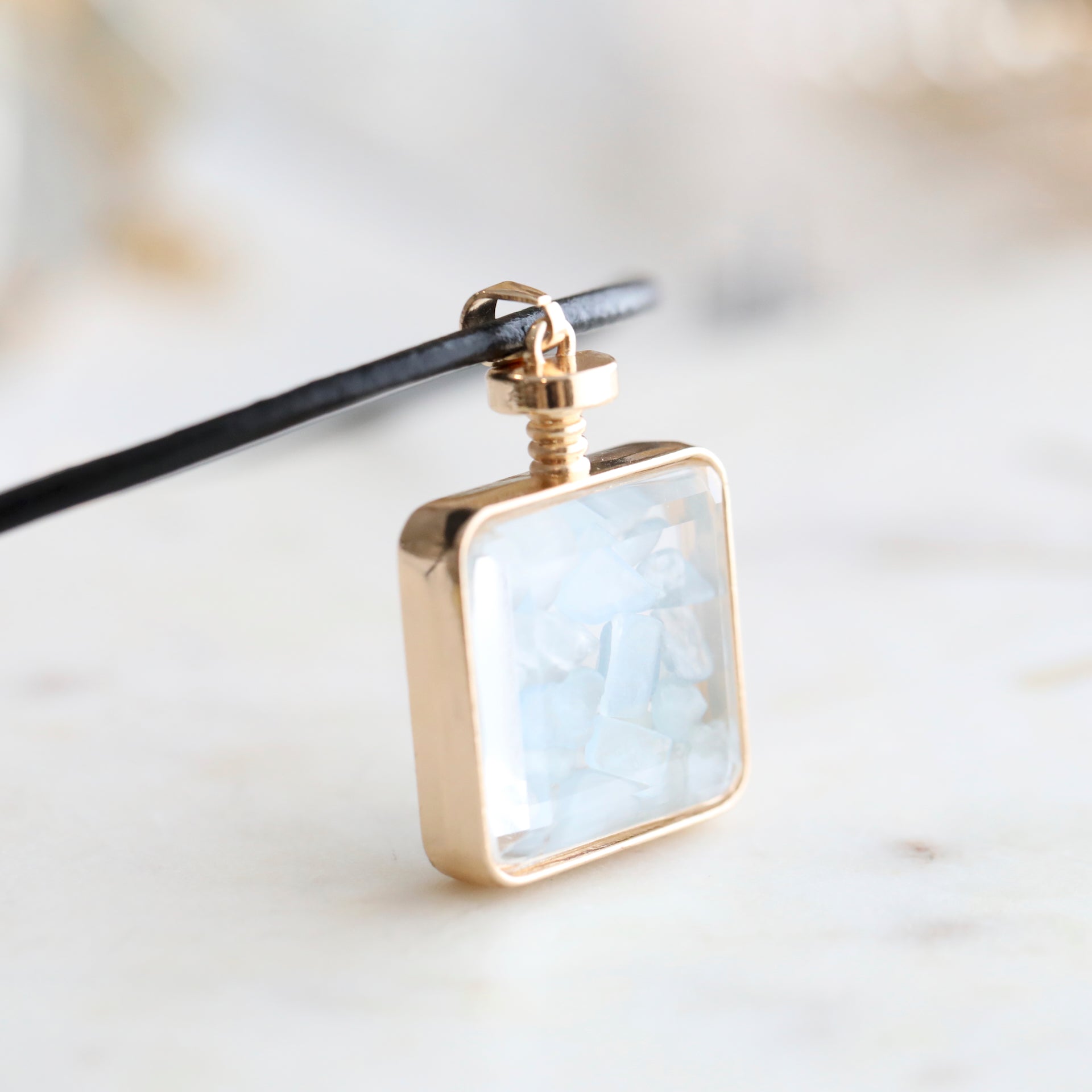 Close-up of Aquamarine Crystal Pendant Perfume Bottle Necklace – Italian Leather Cord with 18K Gold