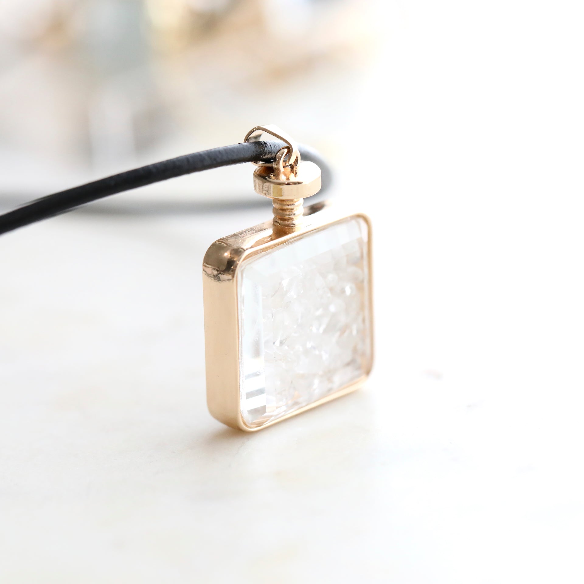 Close-up of Clear Quartz Crystal Pendant Perfume Bottle Necklace – Italian Leather Cord with 18K Gold